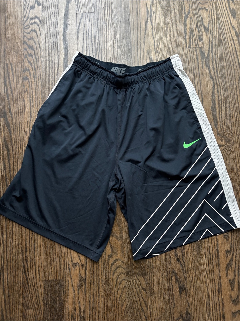 Nike Men’s Dark Navy Athletic Shorts with Green Swoosh and White Stripe